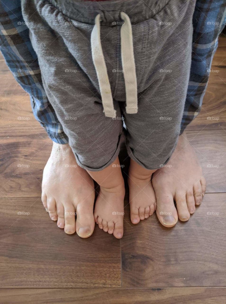 Daddy and baby feet