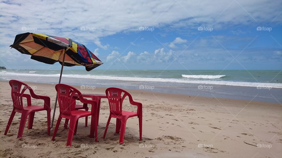 Ipojuca beach. Plastic red chairs. Brazil 