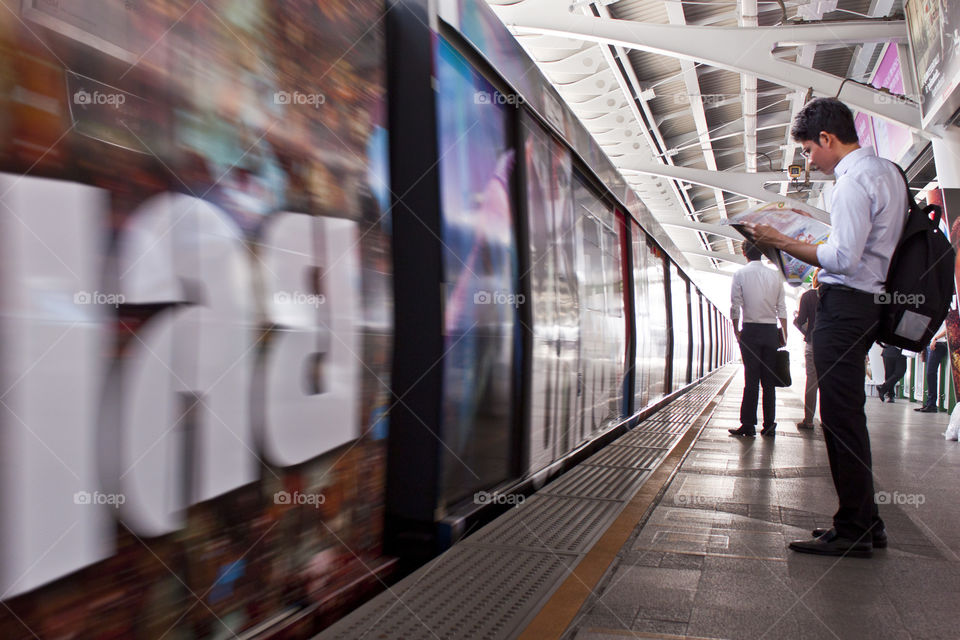 Commuter going to work. Business man waiting skytrain