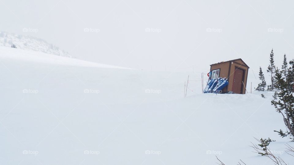 Isolated cabin surrounded by snow