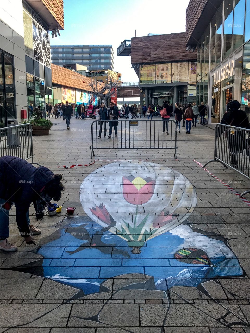 Creating 3d art on the pavement in the city