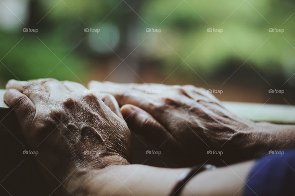 seniors hand on stand waiting for someone 