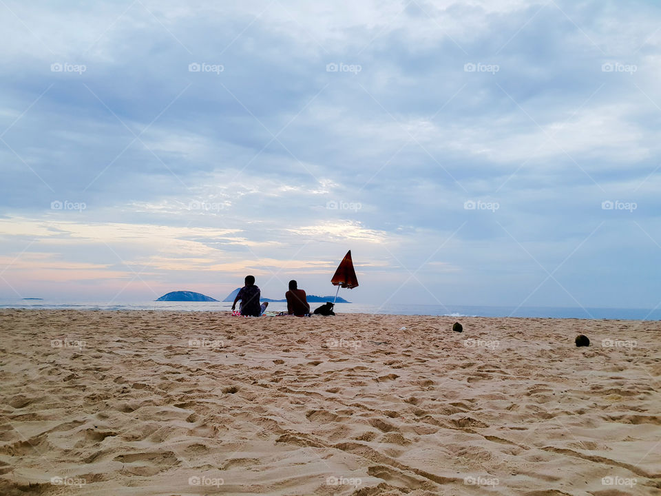 Two people on the Ipanema beach