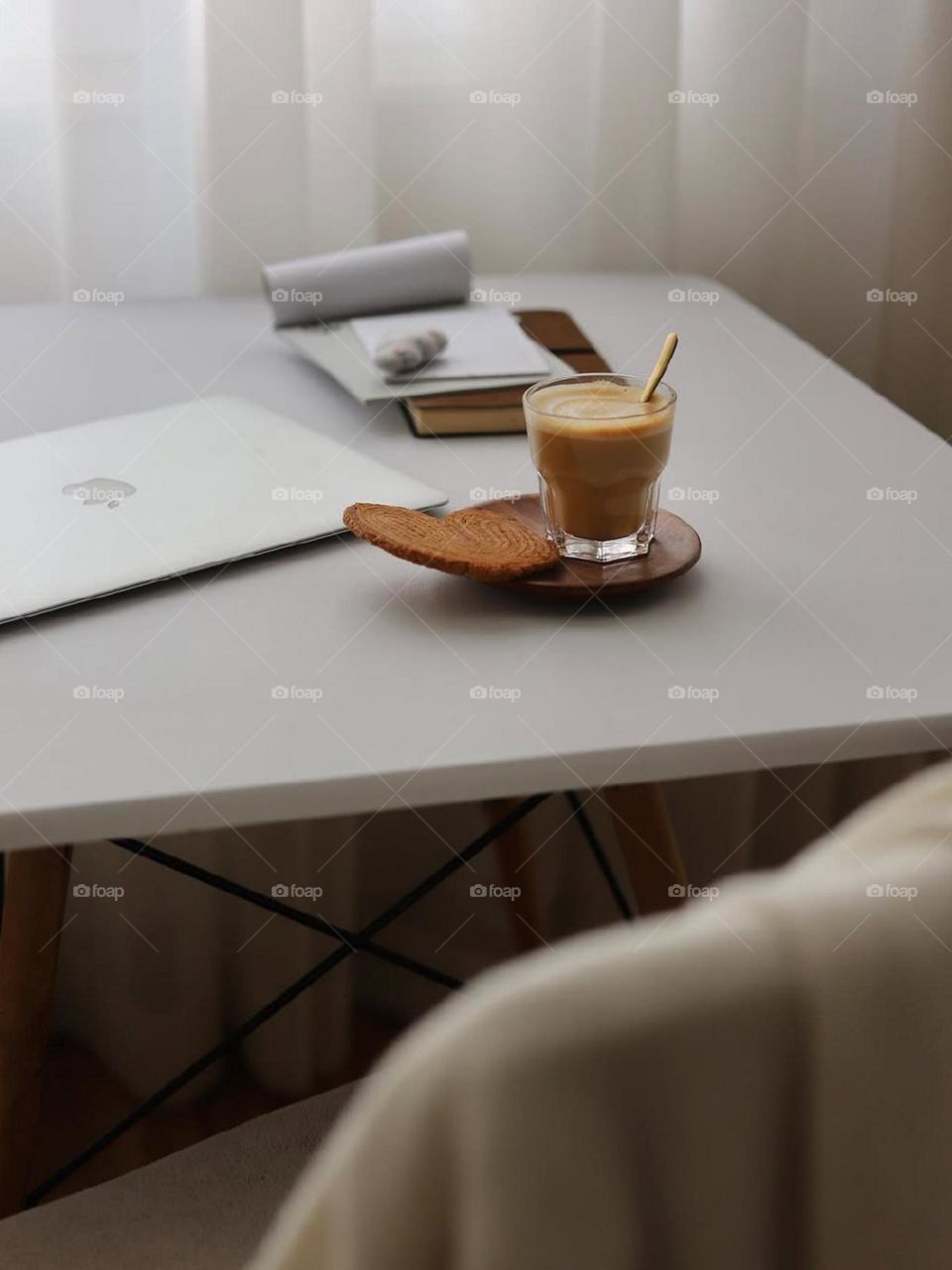 A Macbook, hot coffee, soft light, a clean and tidy desk and some paper and a pen. And I'm focused on my work..