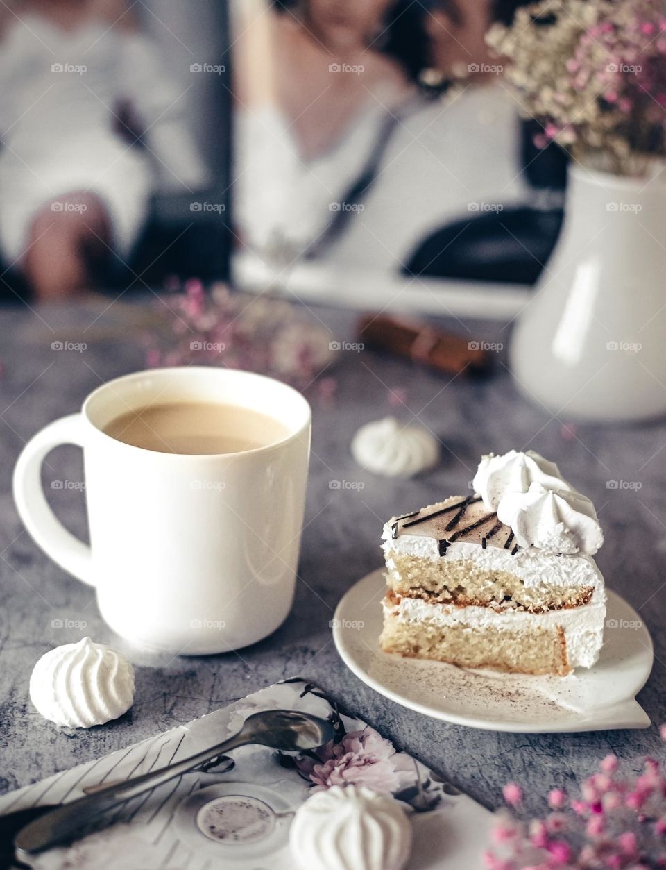 delicious sweet breakfast a piece of cake and a mug of coffee with milk, on a gentle neutral background