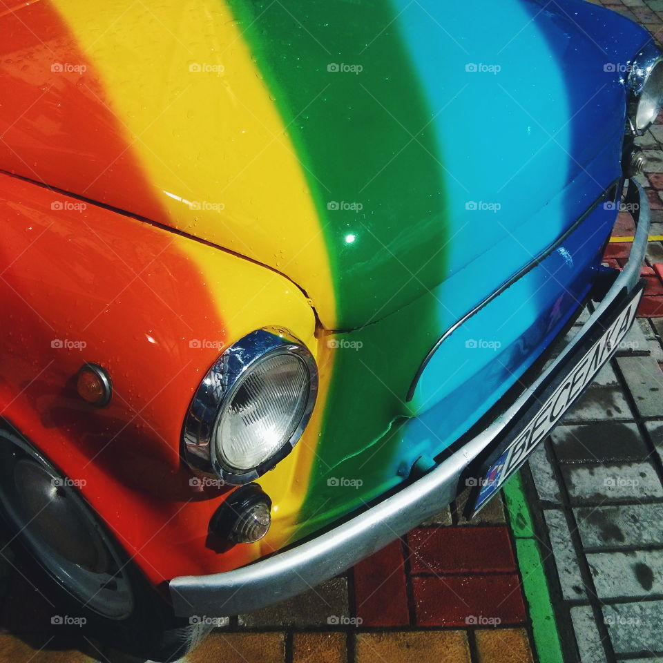 Retro car. Retro car stylized rainbow