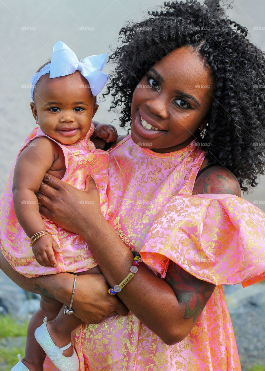 Mother & infant smiling for the camera