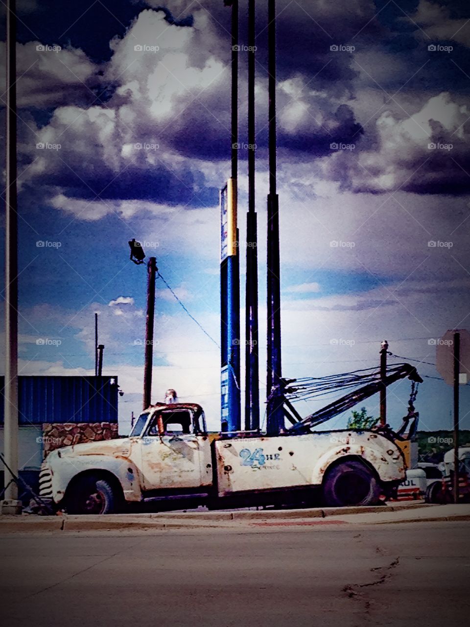 Tow truck & storm clouds