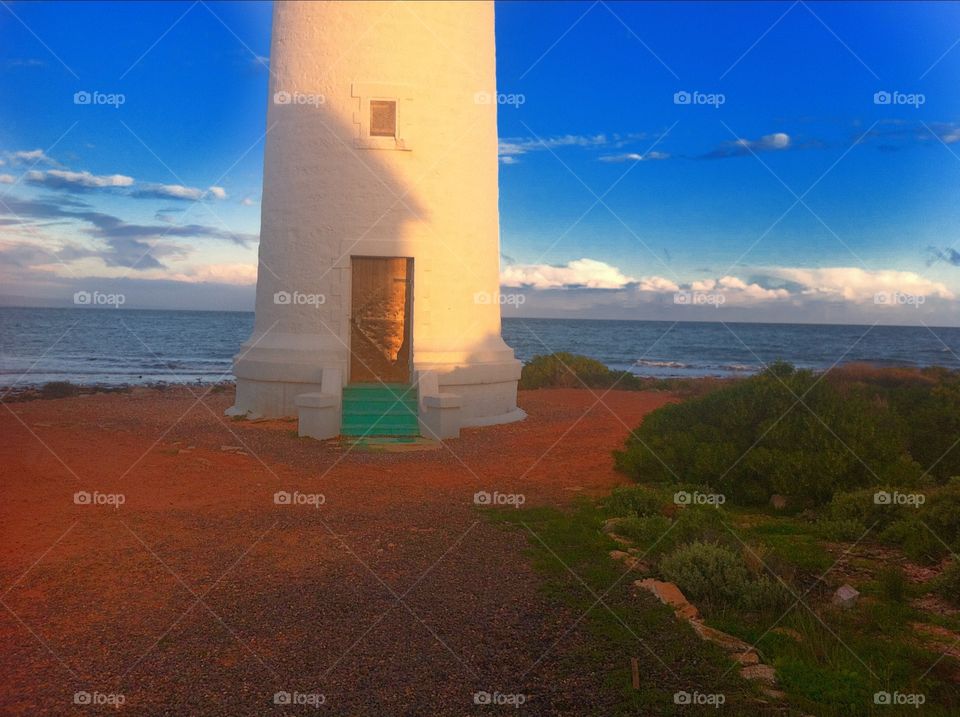 Lower half lighthouse glowing in late sun. Lower half lighthouse glowing in late sun, south Australia