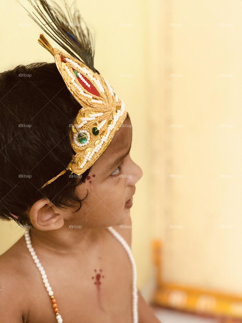 little krishna getup and crown on head