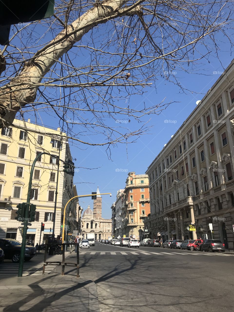 A crossroad in Rome in the sunny daylight.