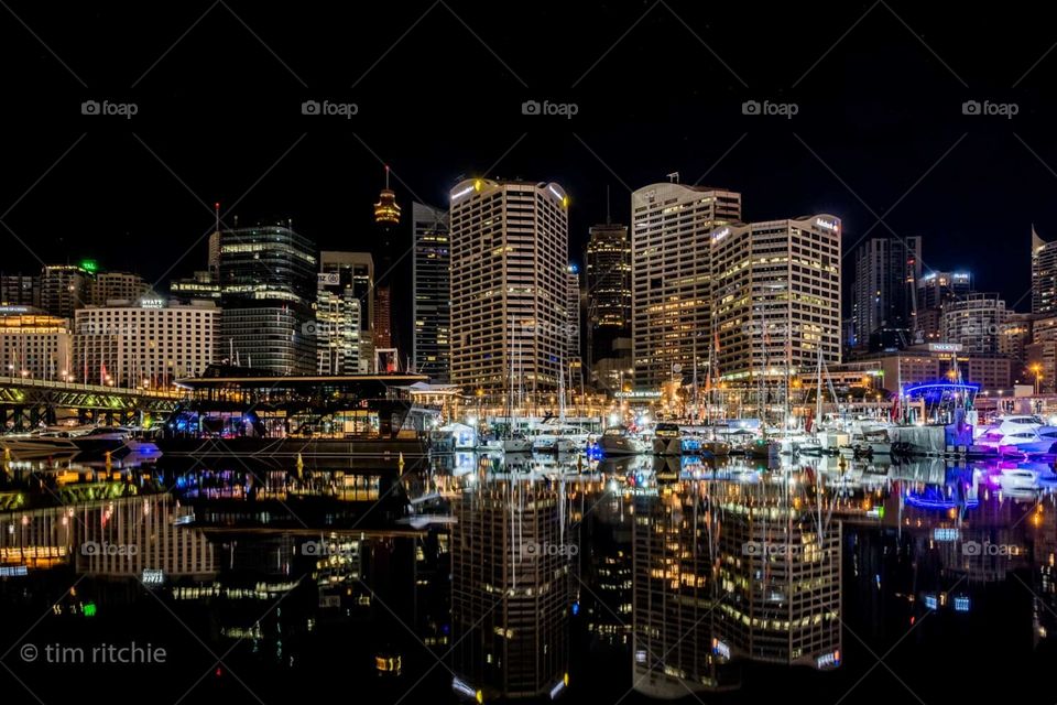 In the still of the early morning, Sydney’s Cockle Bay at Darling Harbour reflects the wharf and towers of the western CBD. 
I love the solitude of being in a city full of people, but they are all hidden away at this time of the day