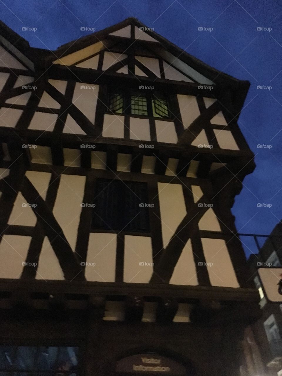 Upwards view of 16th century Leigh-Pemberton House (now a visitor information centre) on Castle Hill in Lincoln showing lovely vintage timber framing