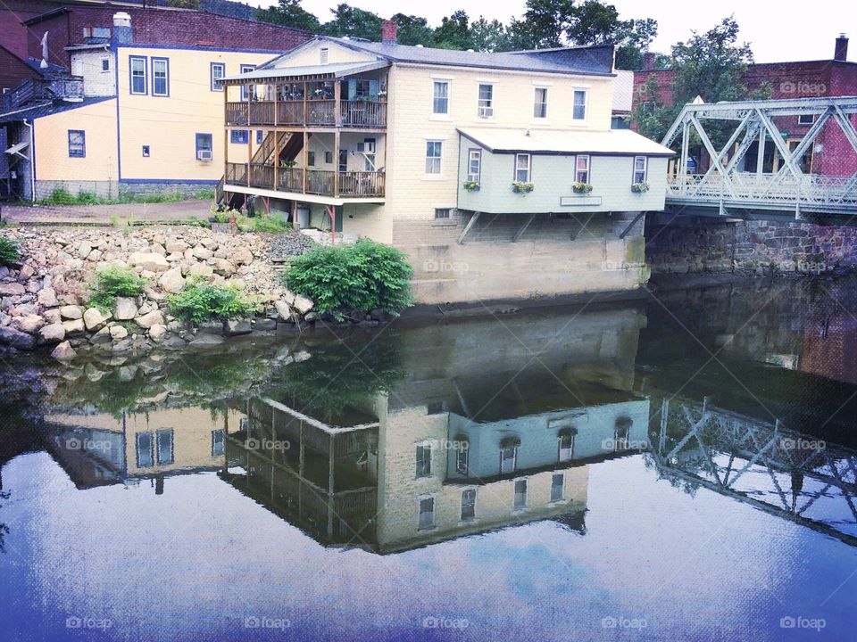 Shelburne Reflection. Building next to the Bridge of Flowers in Shelburne Falls, Massachusetts where the water was calm and mirror like. 
