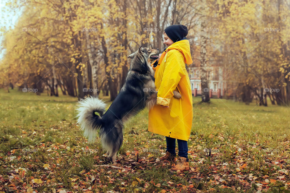 dog hugs a boy