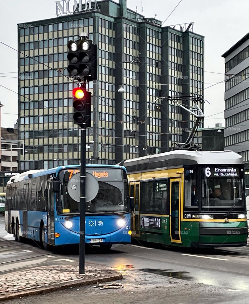 HSL - Helsinki public transpotation, tram and bus racing in Kurvi.