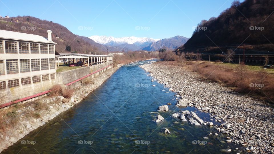 River from ice capped mountains