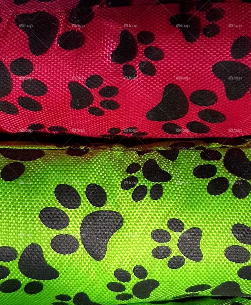 Colorful Fabric Rolls with Black Paw Print Pattern