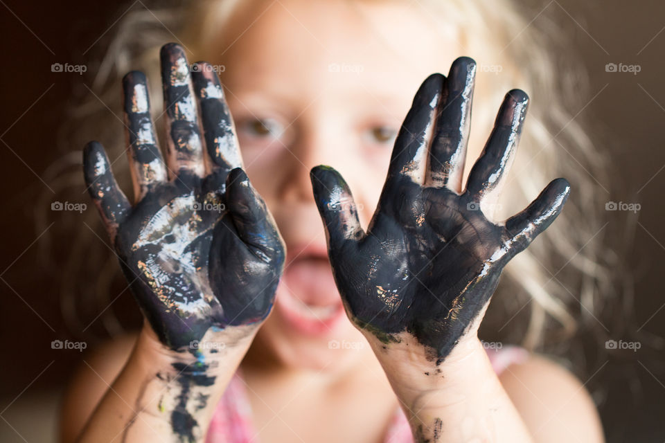 girl painting  with hands