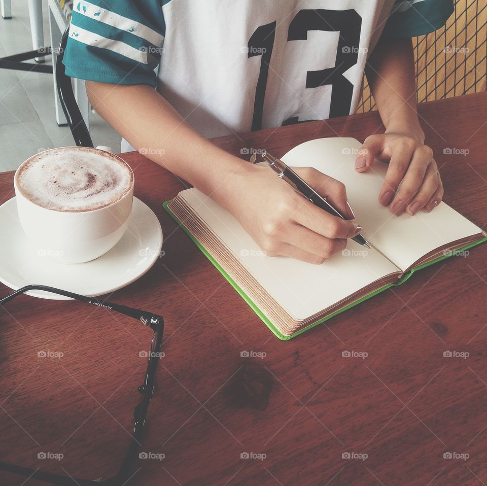 Girl writing in notebook