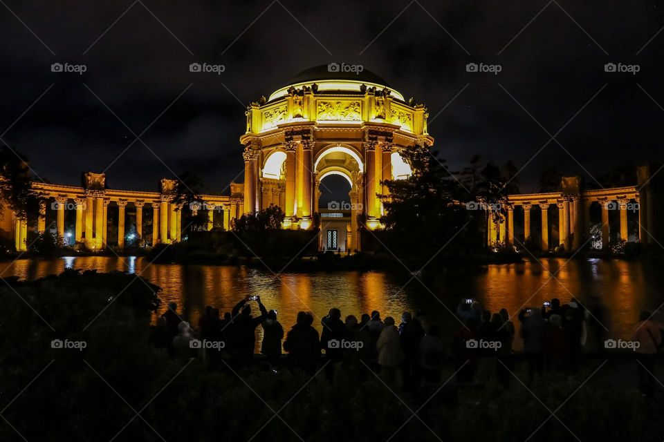 Nighttime at the Palace of Fine Arts in San Francisco California, this beautiful Beaux-Arts designed building by Bernard Maybeck for the 1915 Panama-Pacific International Exposition was meant to resemble Roman Ruins, looking across the lagoon 