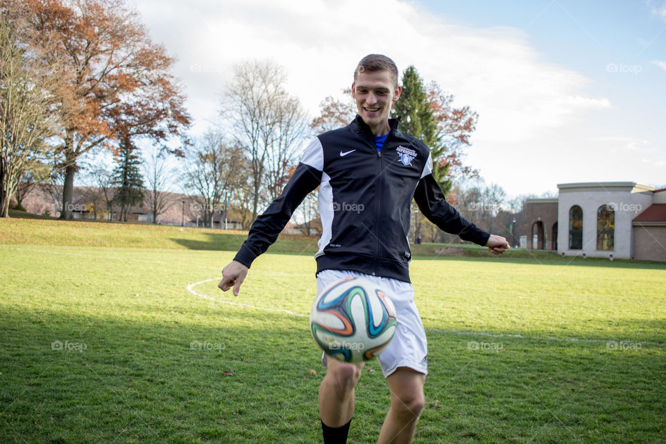 My fellow collegiate soccer teammate juggling the ball on a beautiful day on campus!