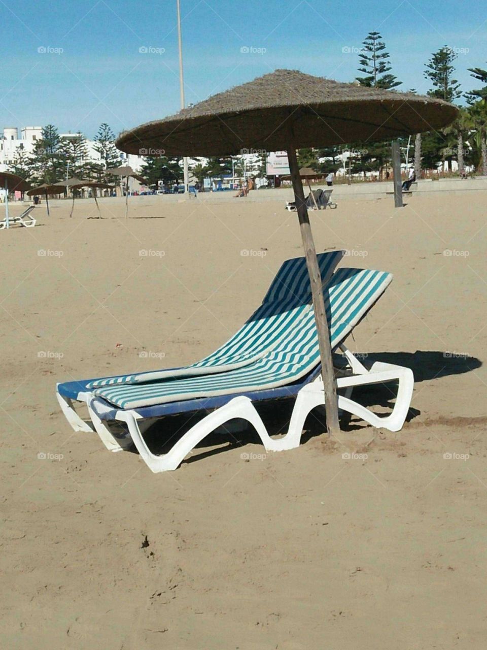 Under the umbrella on sand near the beach at essaouira city in Morocco