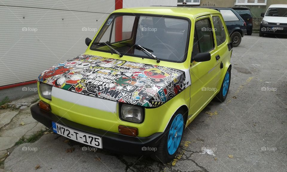 an old fiat car is turned to something beautiful