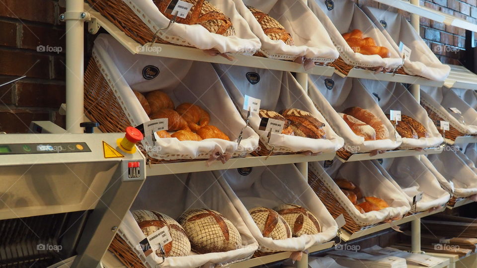 Bakery bread stock. Bakery bread baskets showcased in point of sale display