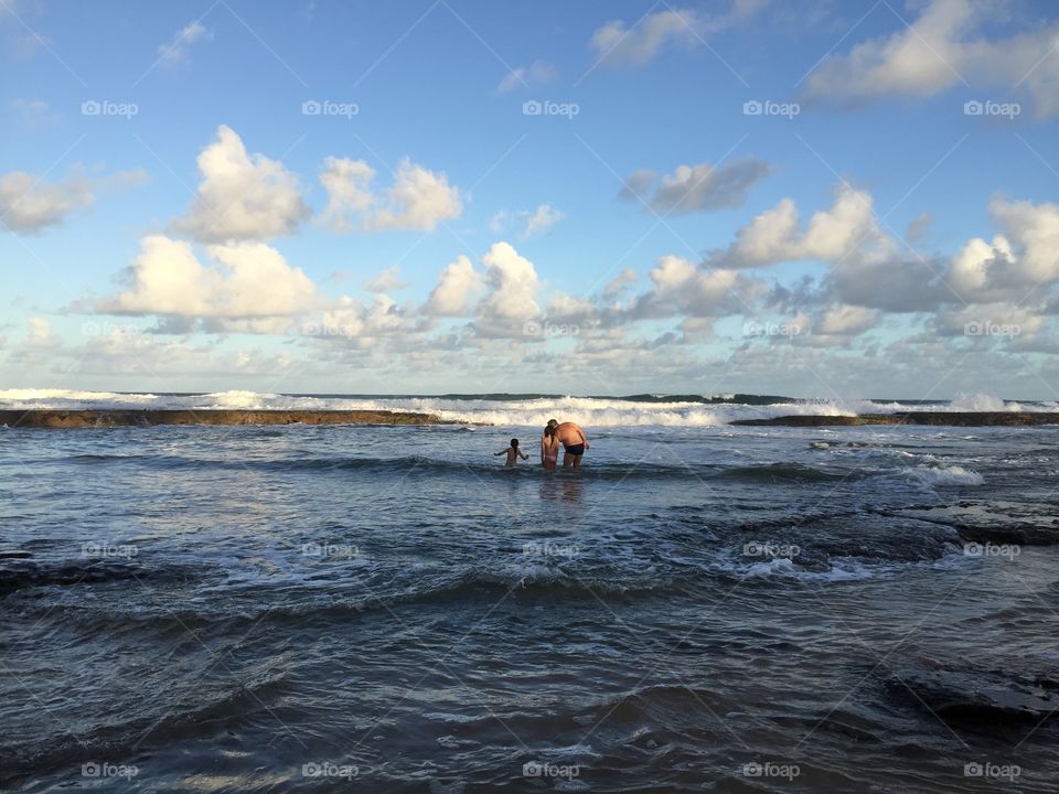 Bahia Brazil father with kids on beach