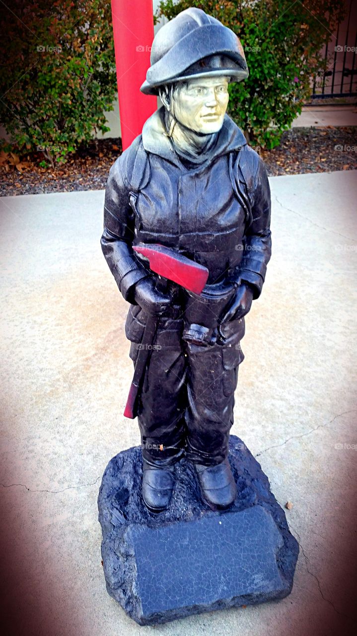 Firefighter Statue. Firefighter Statue in front of our local fire station.