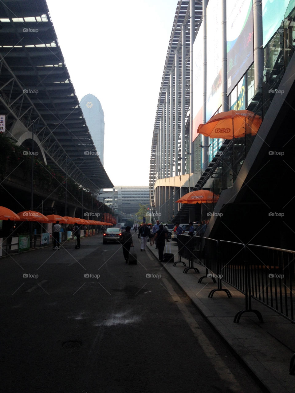 People and umbrellas on a street in Exhibition Center in Shanghai