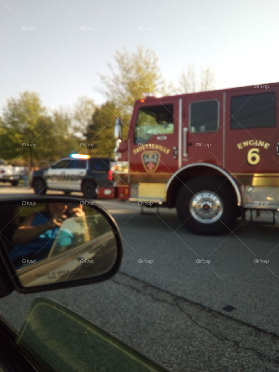 a fire truck and a patrol car on the scene, traffic is backed up a couple miles at least.