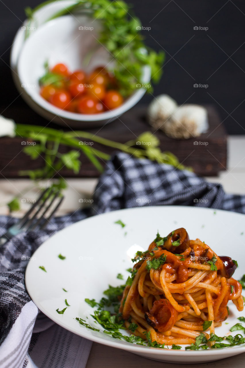 Spaghetti alla puttanesca
My sister cooks and I take the shot.