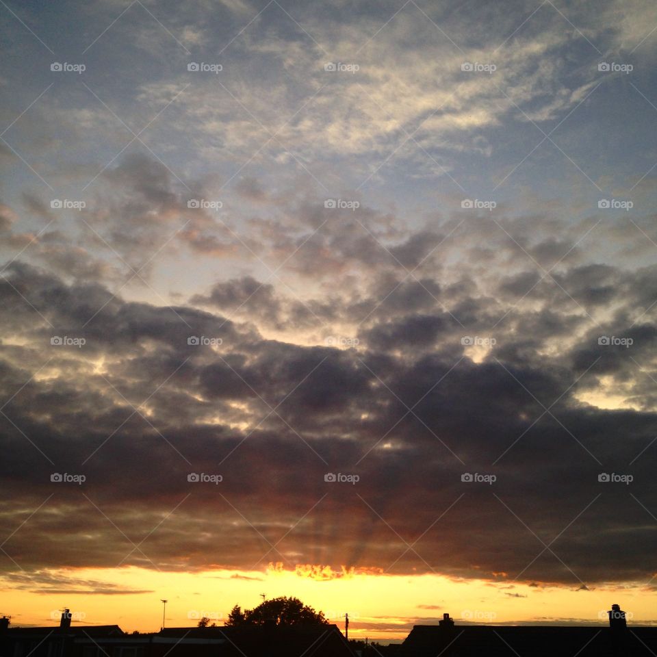 Sunsets beginning . The start of a sunset in the north west of England, the sky was split beautifully and the suns rays were powerful.