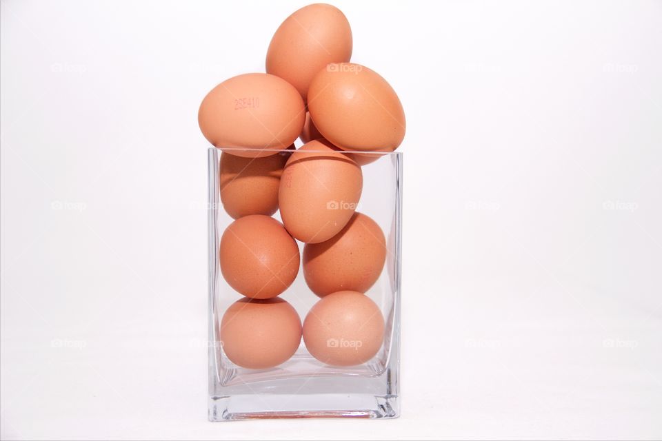 Eggs over white background