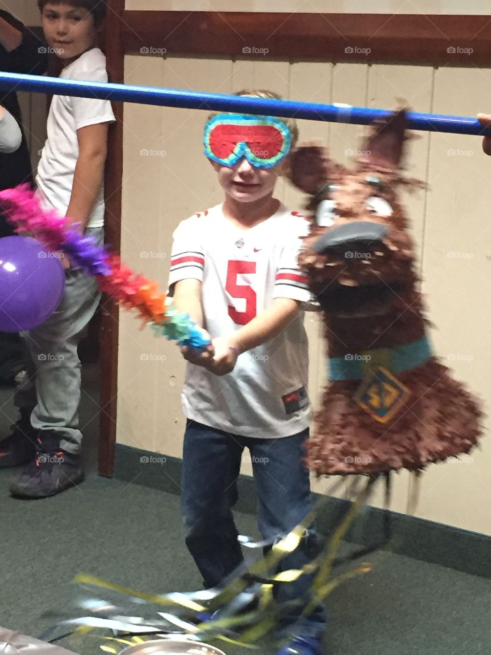 Scooby Do gets whacked . Piñata fun at a birthday party