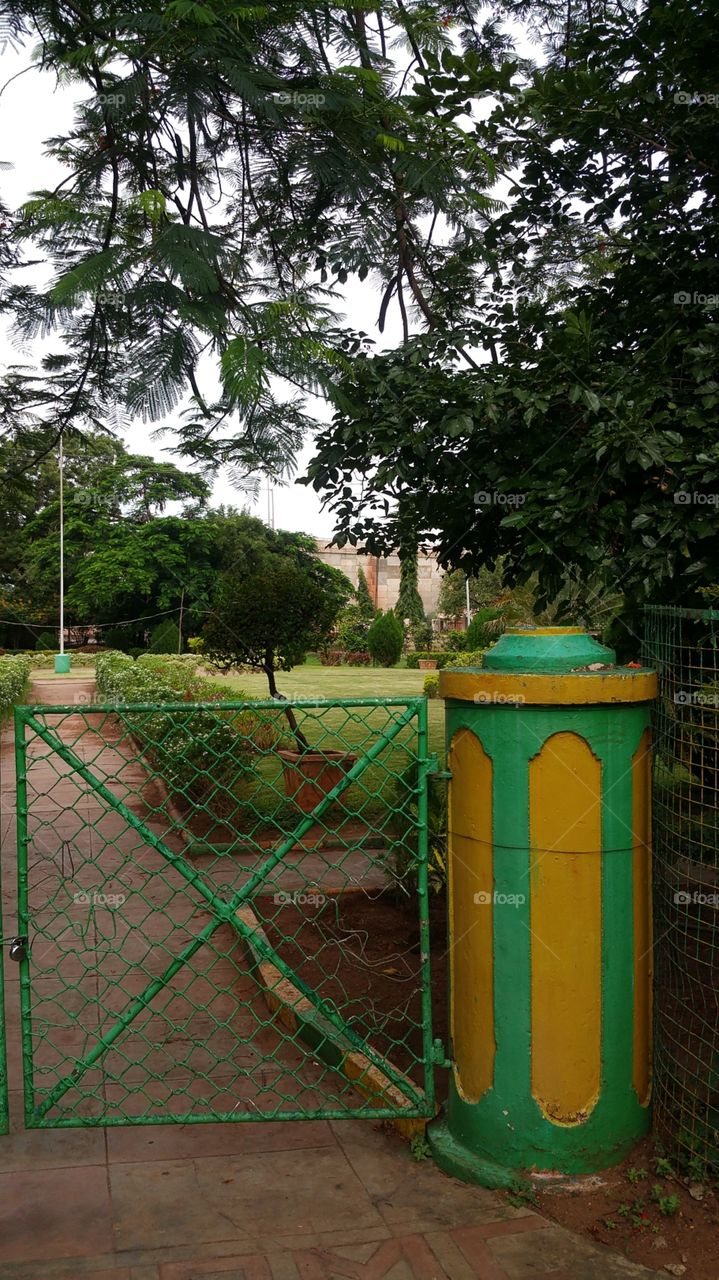 entrance to park rusty colourful iron gate