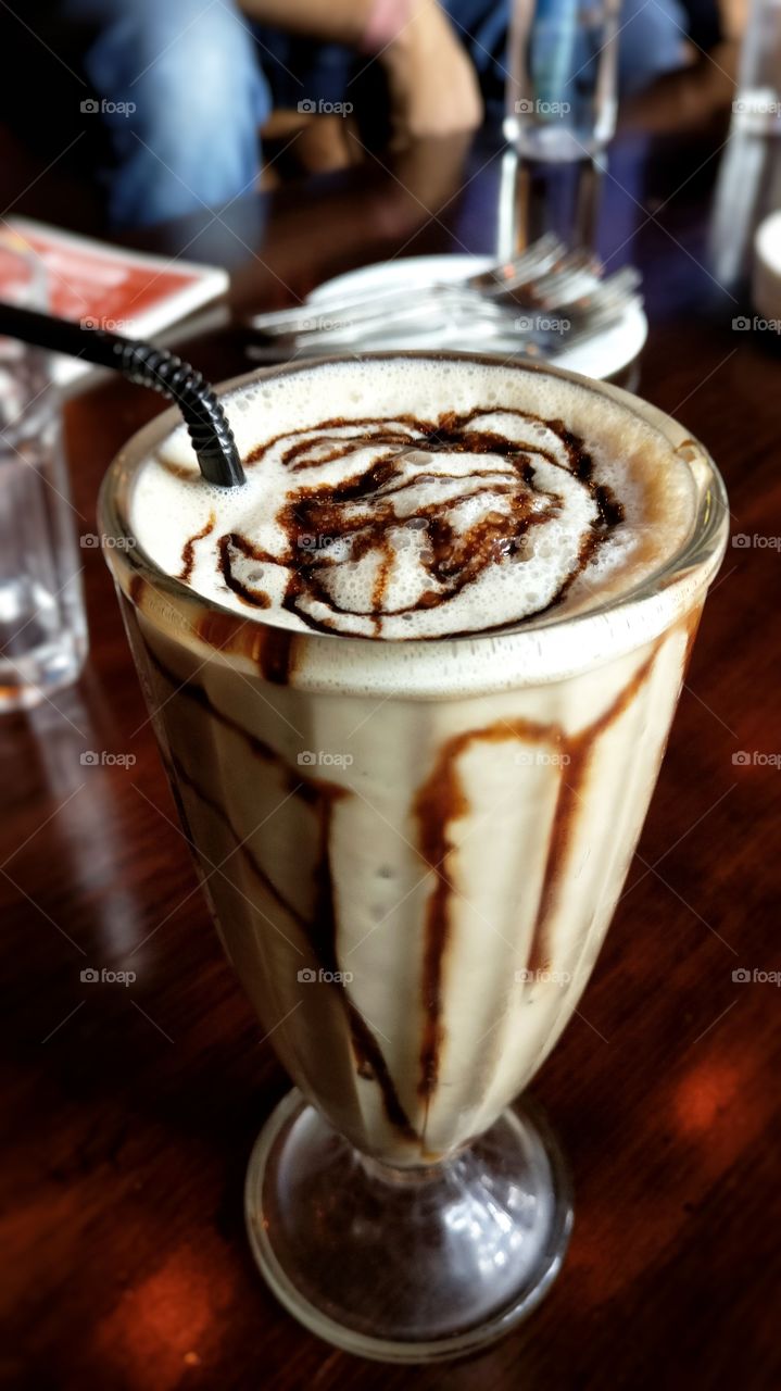 Delicious chocolate shake in a glass.