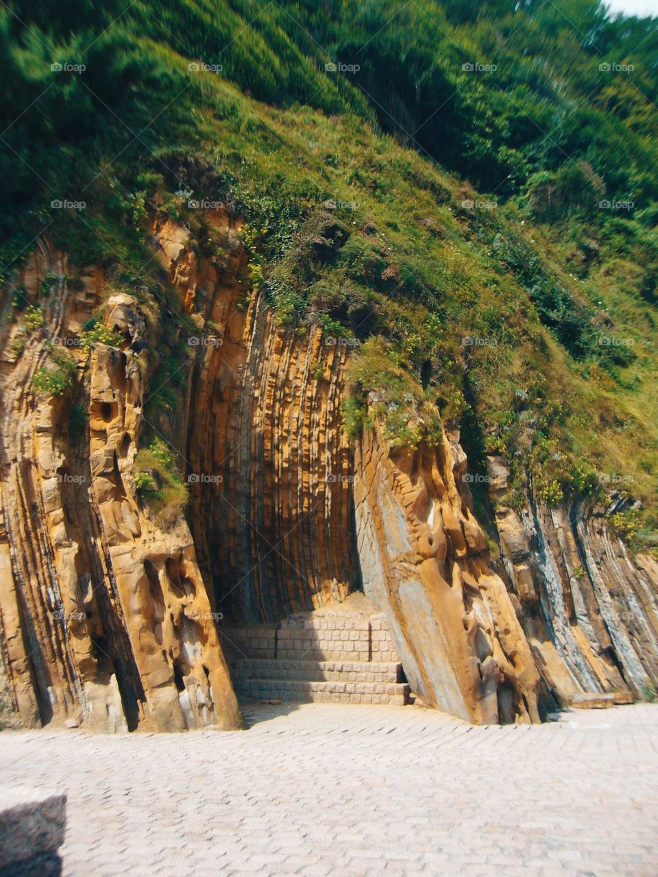 The mountain eats the city.