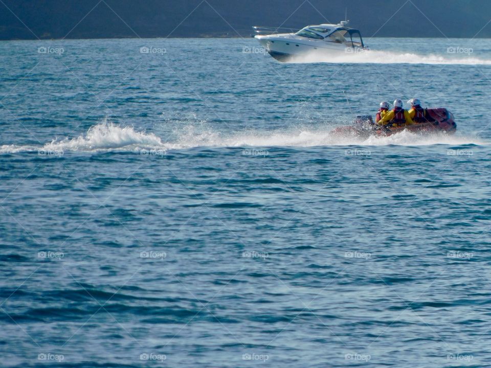 Royal National Lifeboat Institute on an inland emergency rib heading to an emergency in Dartmouth
