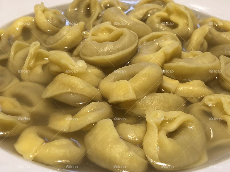 Tortellini, italian filled pasta with capon broth