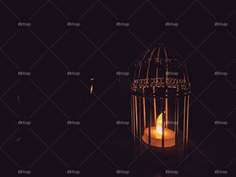Candle in a bird cage holder 