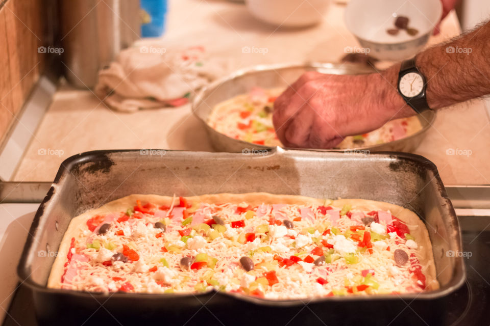 Man Prepares And Cooking Pizza At Home
