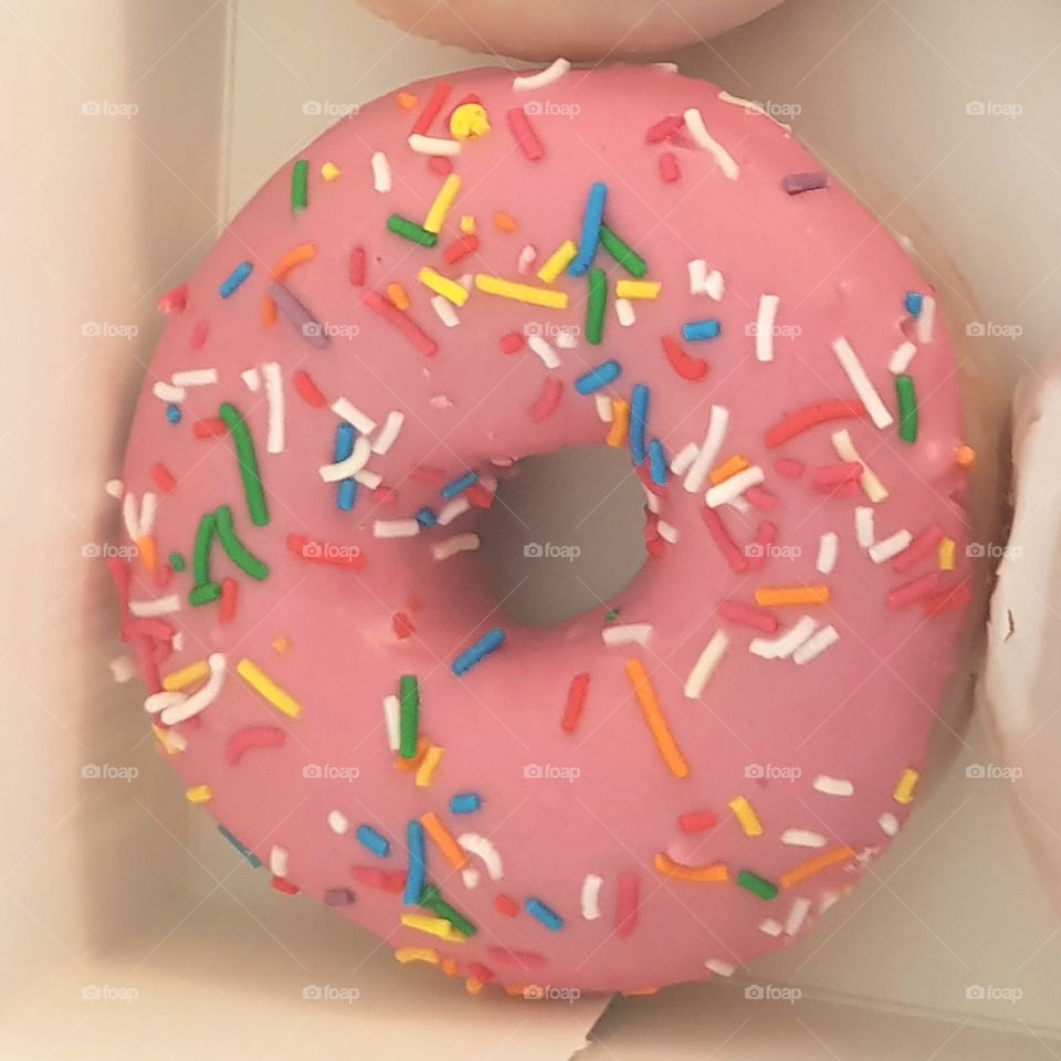pink doughnut with sprinkles