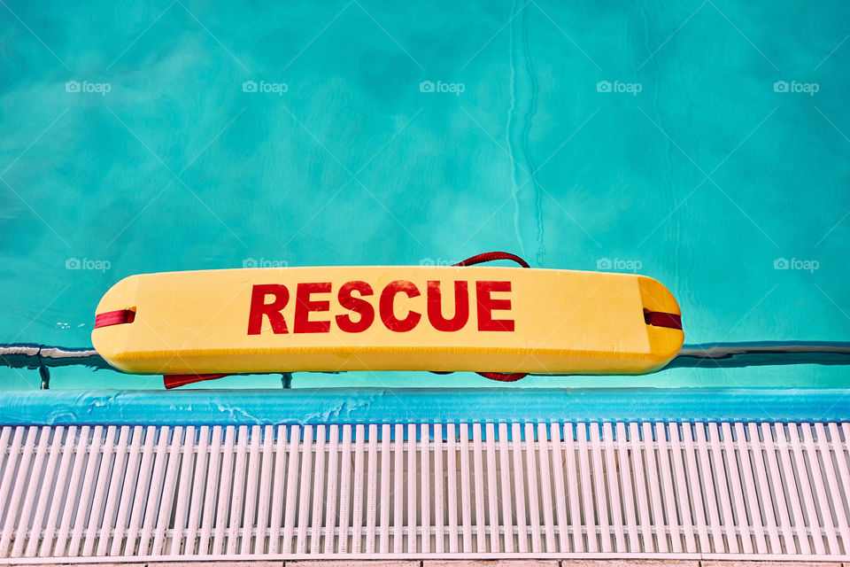 Lifesaver equipment on swimming pool. Candid people, real moments, authentic situations