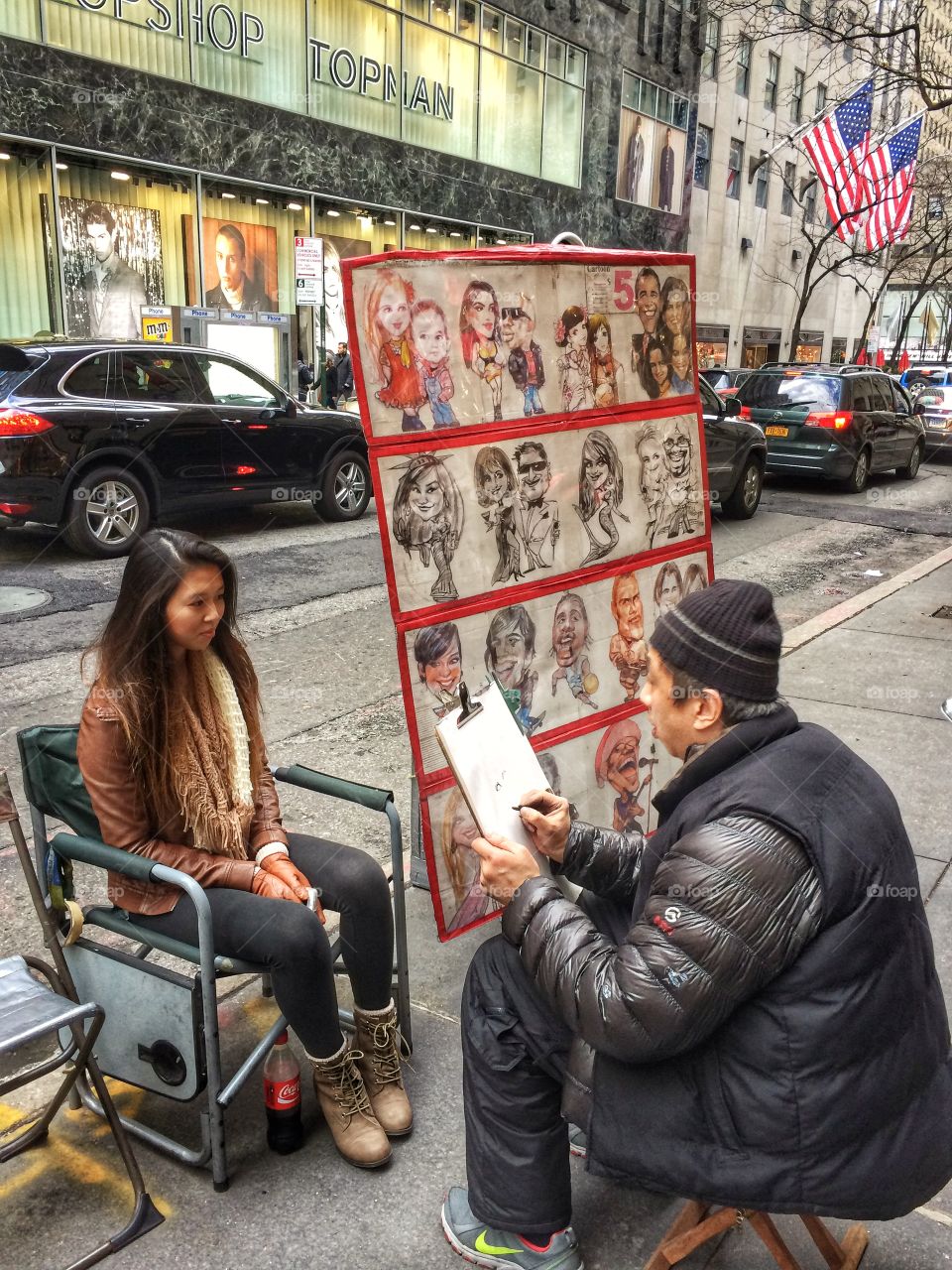 Sketch artist sketching woman's face on street