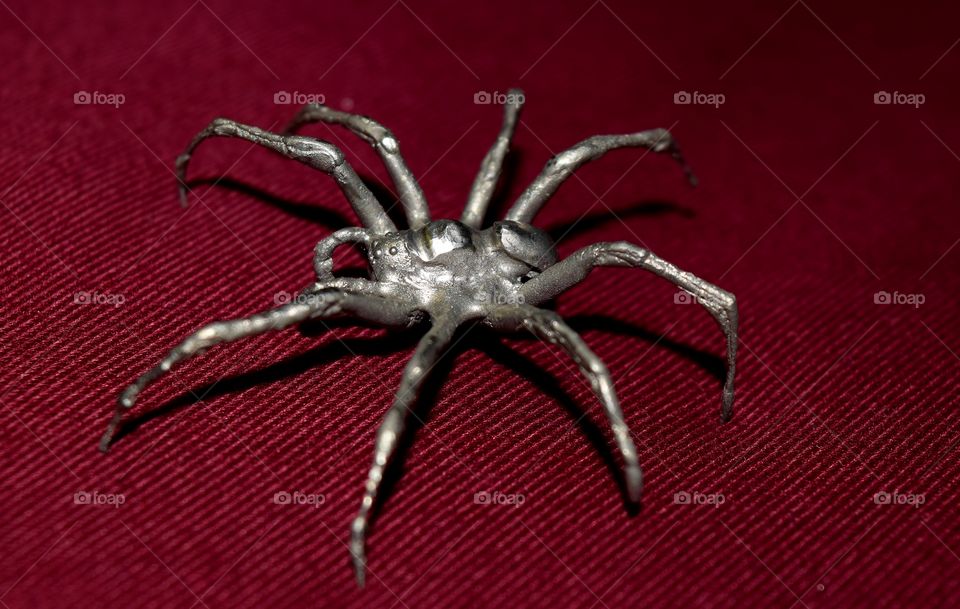 A spider cast out of metal