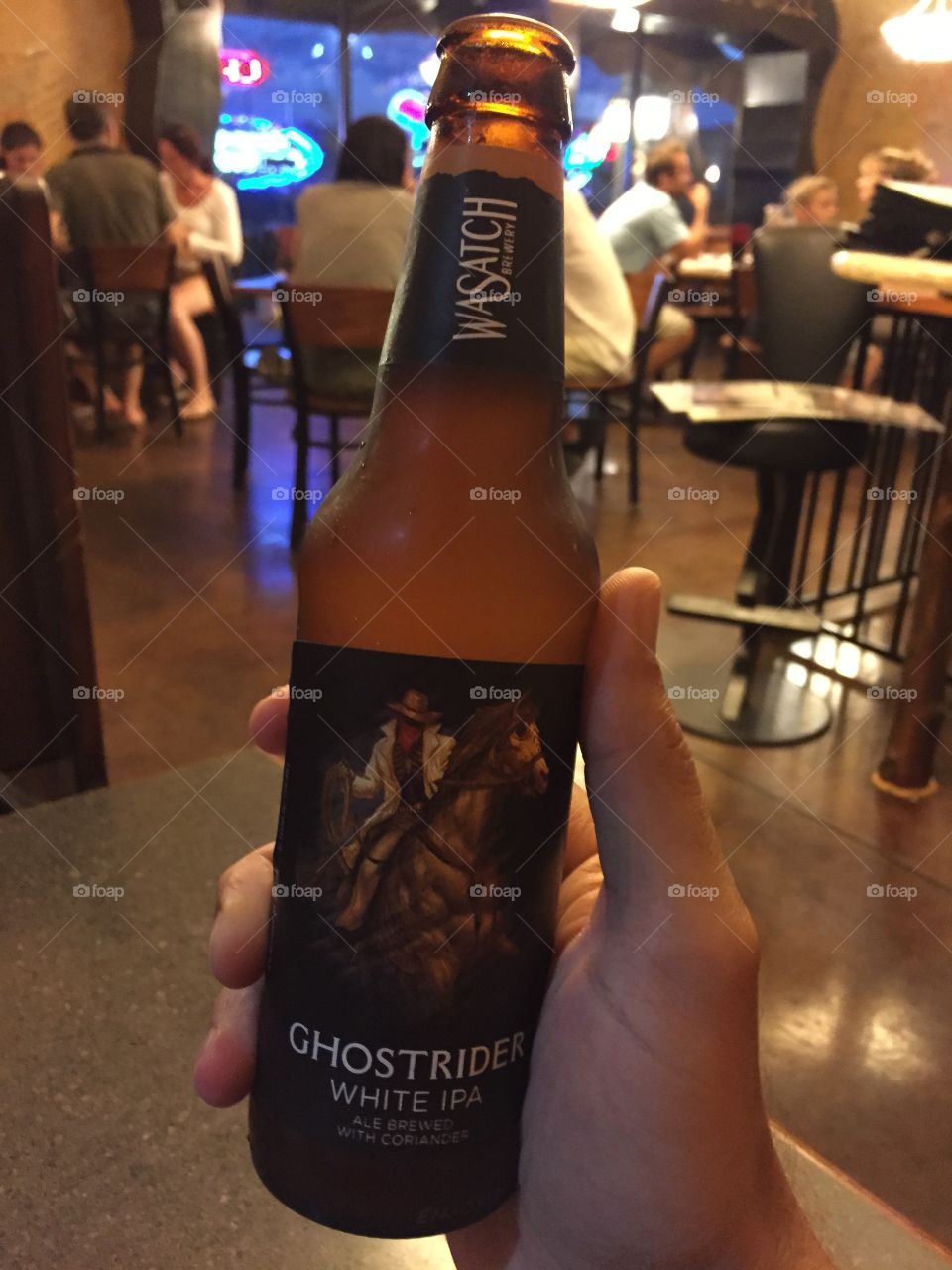 Ghostrider beer in my hand at the restaurant