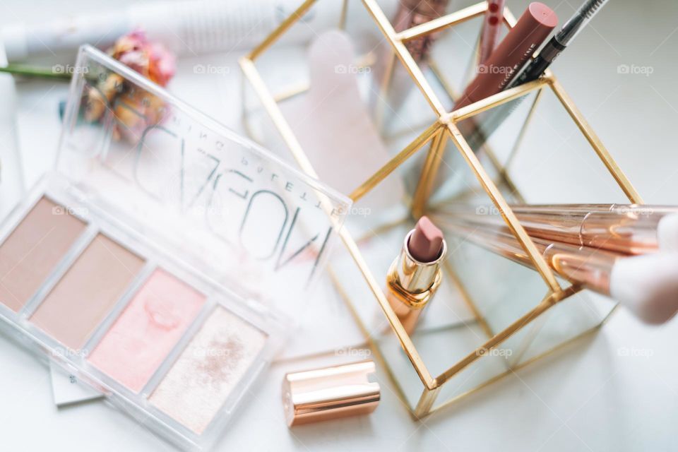 Makeup products on window sill